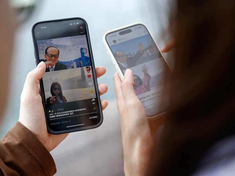 Women search on the Chinese social media platform Xiaohongshu, in Hong Kong, China, April 30, 2024.