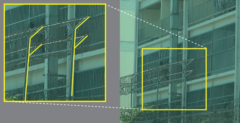 This image released by Amnesty International on June 26, 2025, as part of a report on scam centers in Cambodia shows the “eastern perimeter wall of a scamming compound in Phnom Penh that is heightened and angled towards the interior with barbed or razor wire on the inside to prevent climbing.“