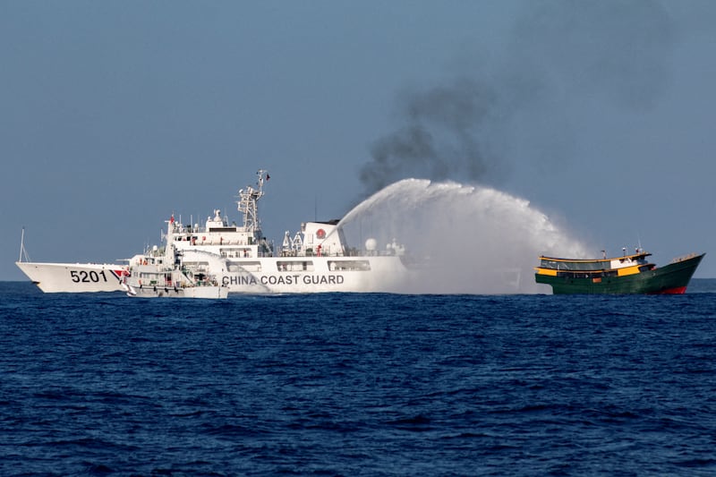Chinese Coast Guard vessels fire water cannons towards a Philippine resupply vessel Unaizah May 4 on its way to a resupply mission at Second Thomas Shoal in the South China Sea, March 5, 2024.