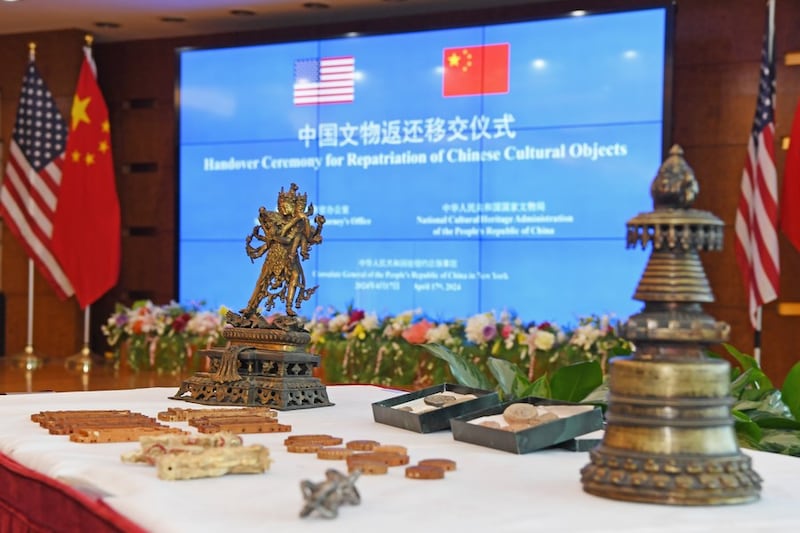The U.S. handed over 38 items to China, many of which were Tibetan Buddhist artifacts, in April 2024. Seen here are Tibetan wood carvings, Buddhist statues and a bronze pagoda.